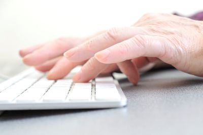 Picture of a person typing at a keyboard - advertising materials in Fontana, Rancho, Jurupa, Riverside and Eastvale